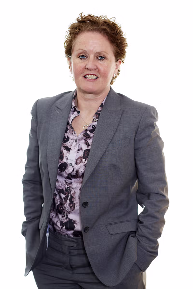 Corporate profile portrait of a professional in a grey suit on a white background