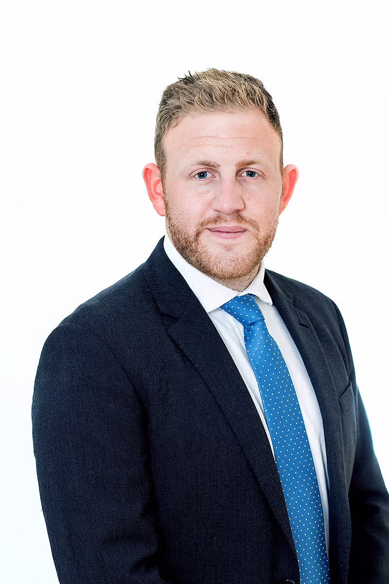 Corporate profile portrait of a professional in a suit with blue tie on a white background