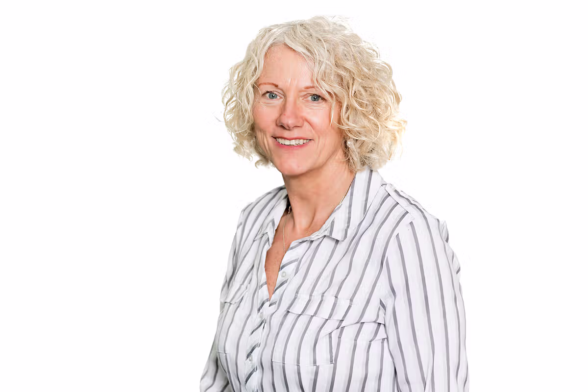 Professional staff headshot on a white background for business profile photography