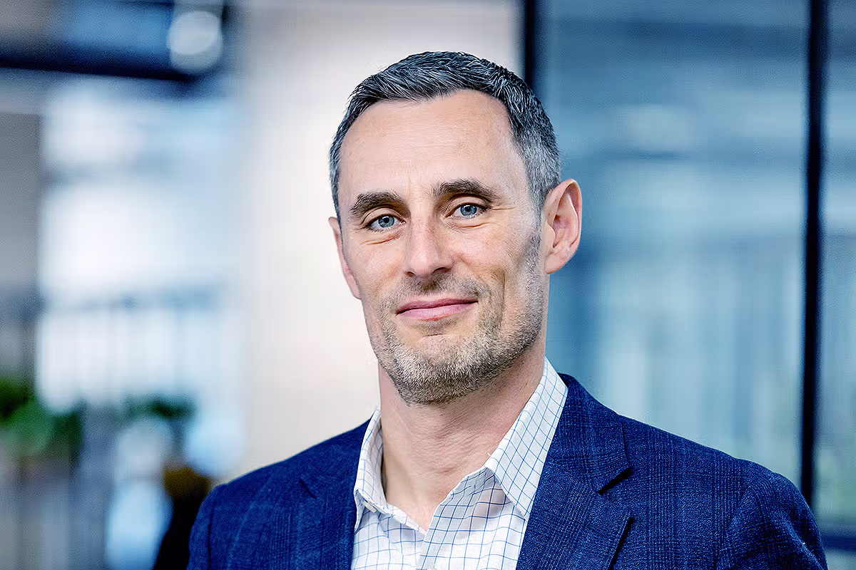 Corporate portrait of a senior business professional in a modern office setting for leadership and profile use