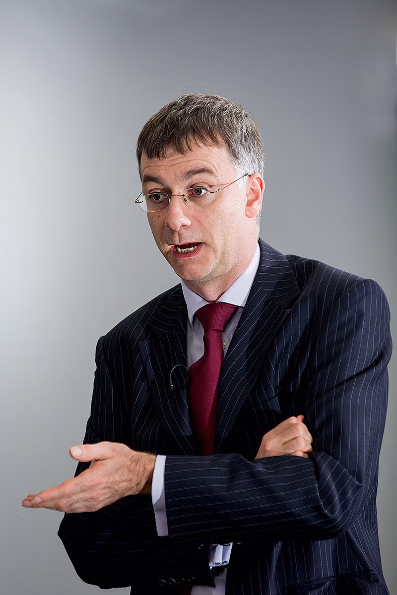 Internal communications style executive portrait in a professional office setting
