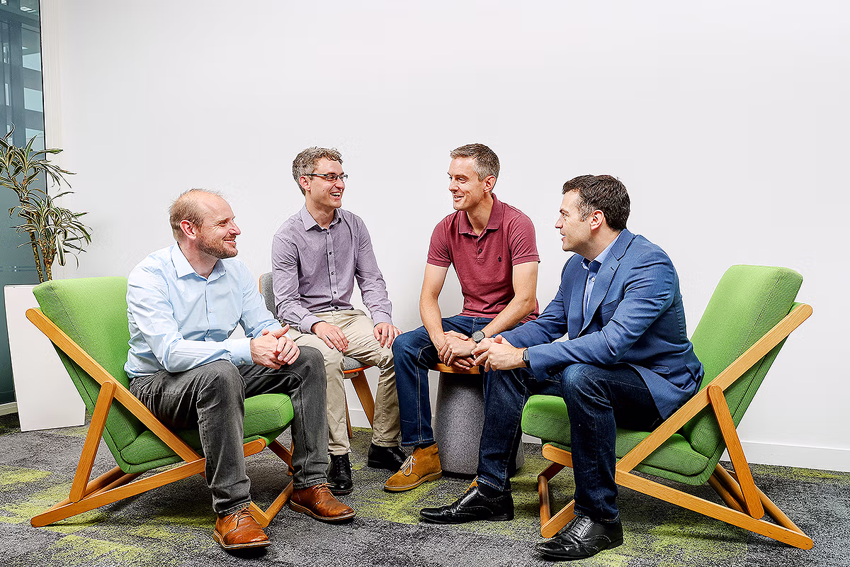 Office culture photography of a team discussion in a workplace setting