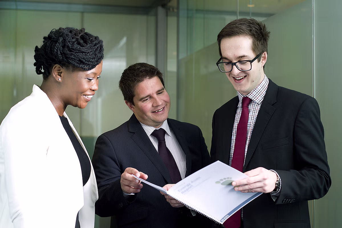 People reviewing documents in a professional office environment