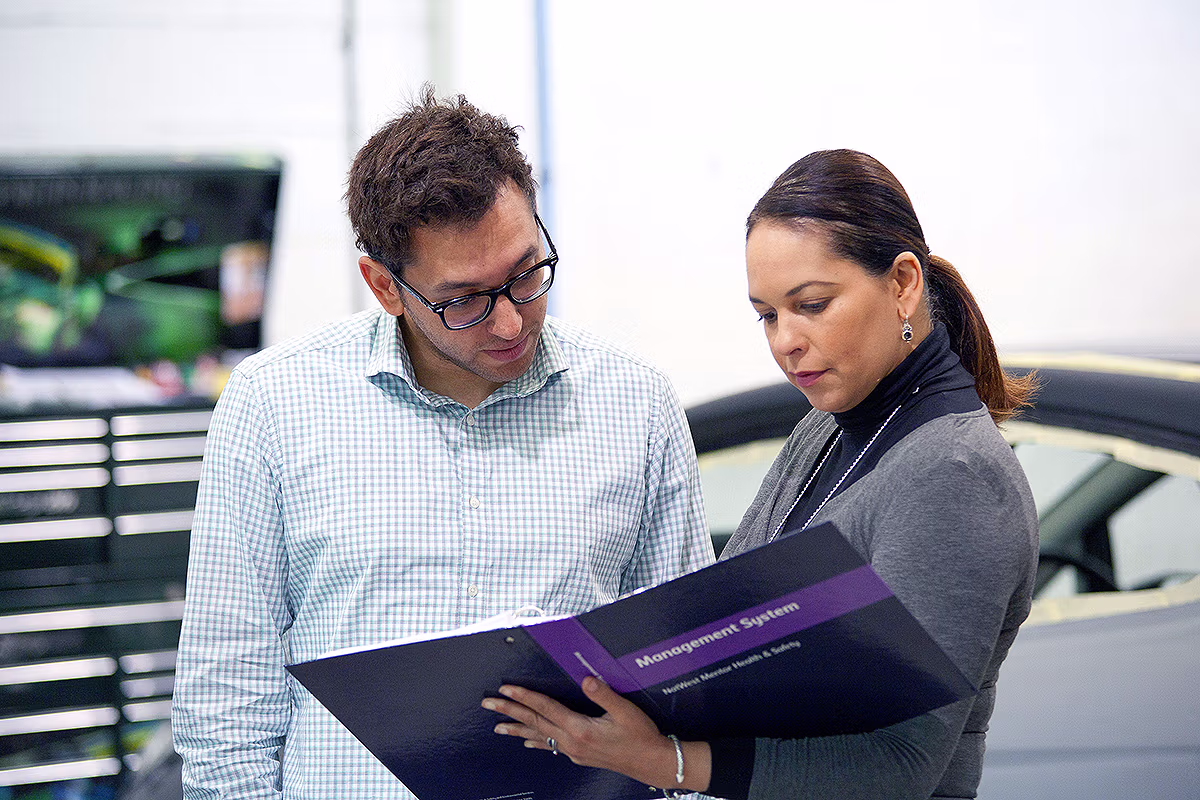 Corporate photography of a folder review in a multi-location business environment