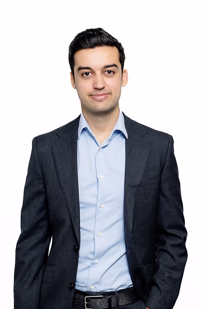 Corporate headshot of a young professional on a white background for business and recruitment use