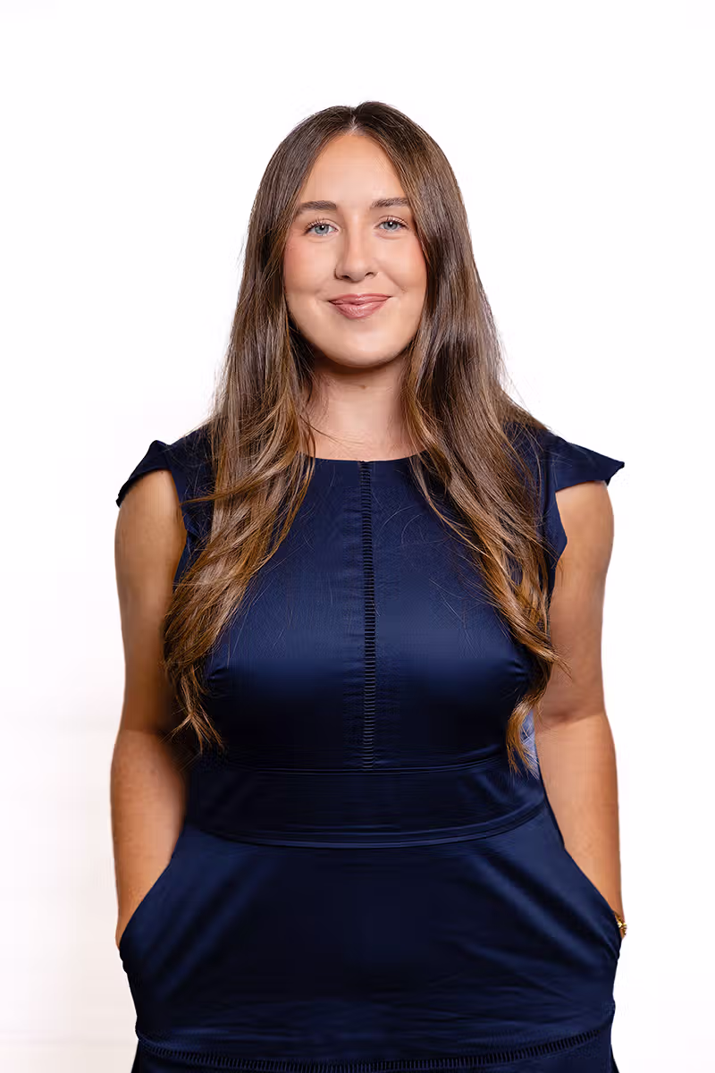 Professional headshot of a woman on a white background for business profile use