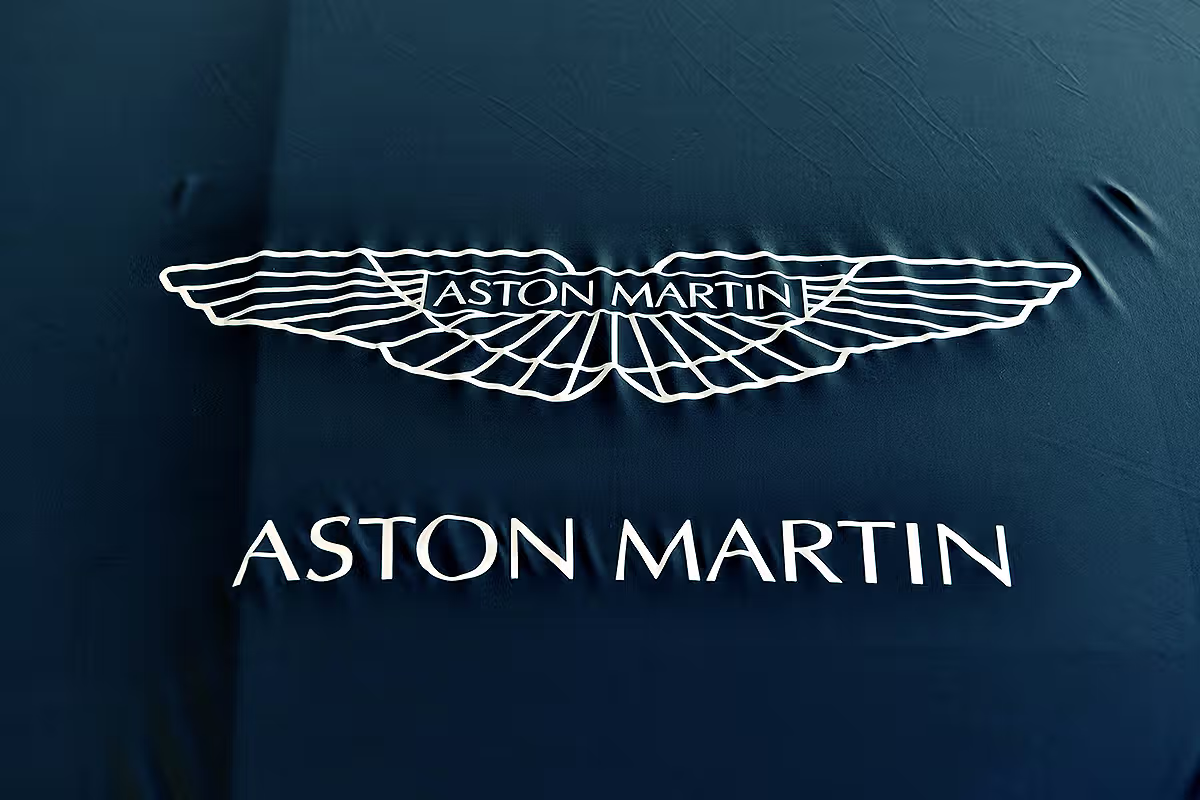 London event photography for Aston Martin at a Kensington dealership with guests, showroom setting and branded automotive event atmosphere