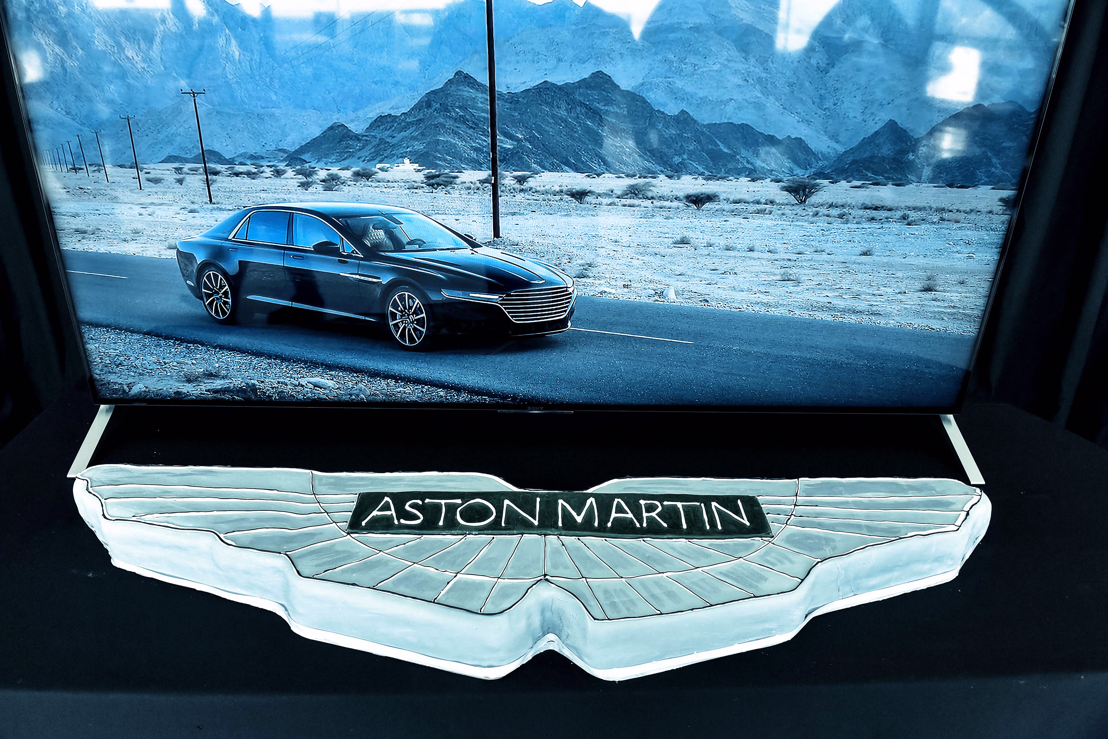 Event photographer in London covering an Aston Martin showroom event in Mayfair, with presentation, guest setting and luxury vehicle display at Aston Martin London, 113 Park Lane, London W1K 7AJ
