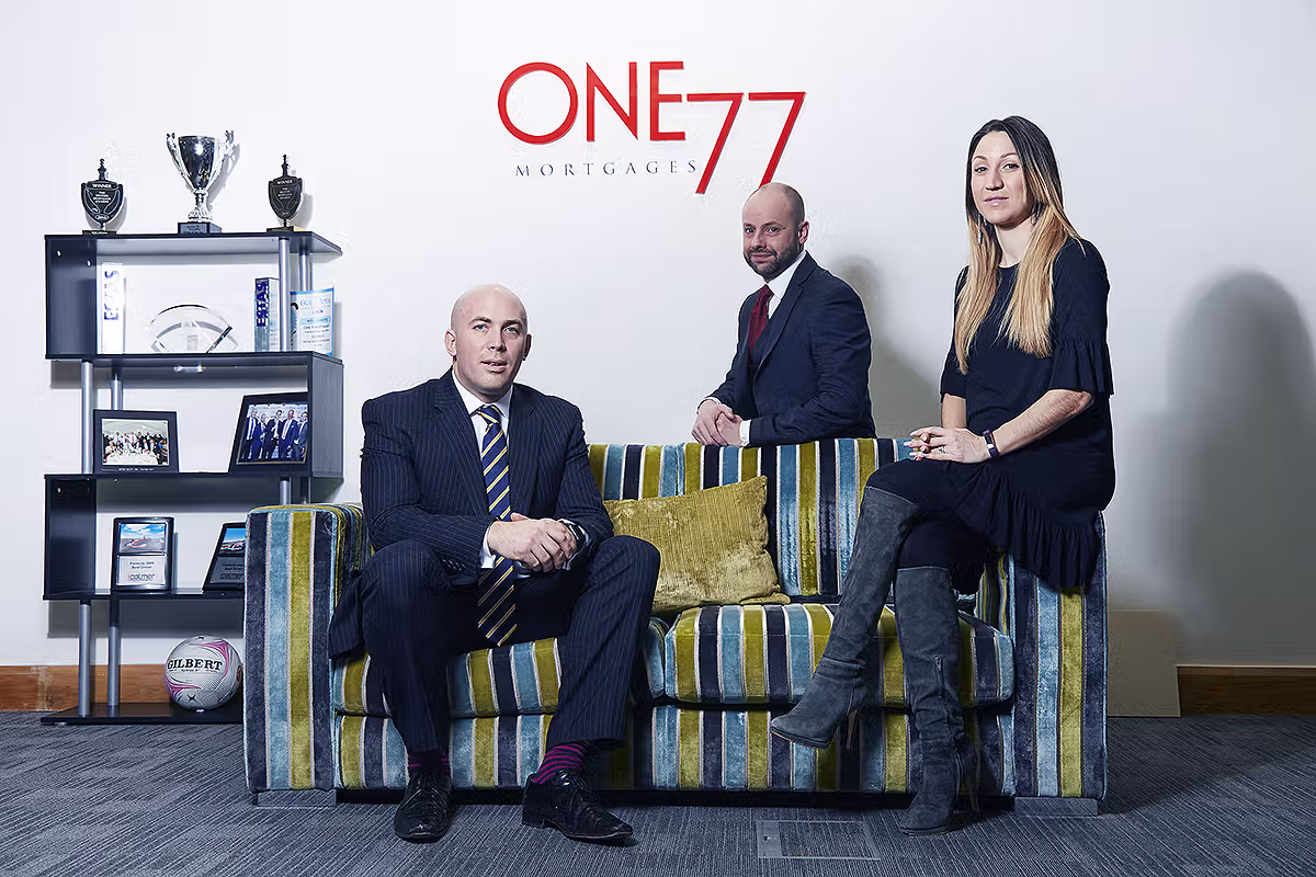 Corporate group portrait in an office lounge or branded interior setting