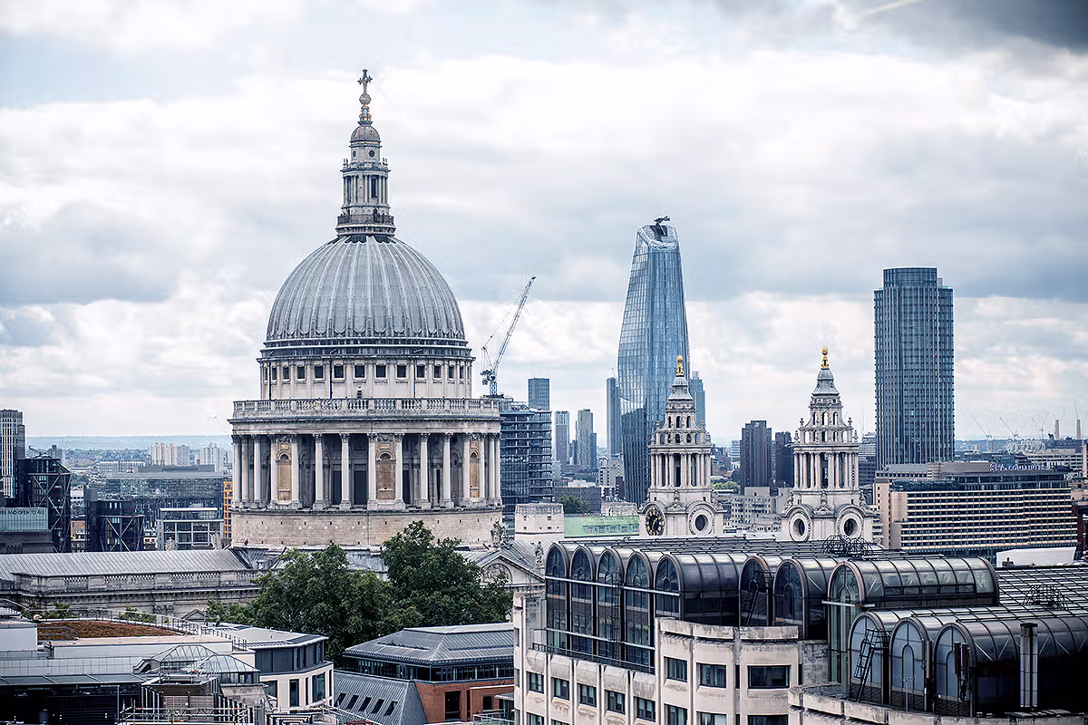 London skyline photograph featuring St Paul's Cathedral and modern City office towers