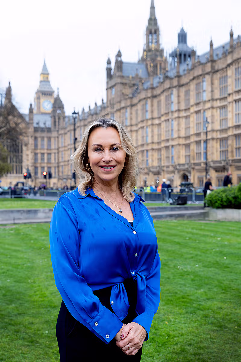 Portrait of a businesswoman outside the Houses of Parliament with Big Ben in the background