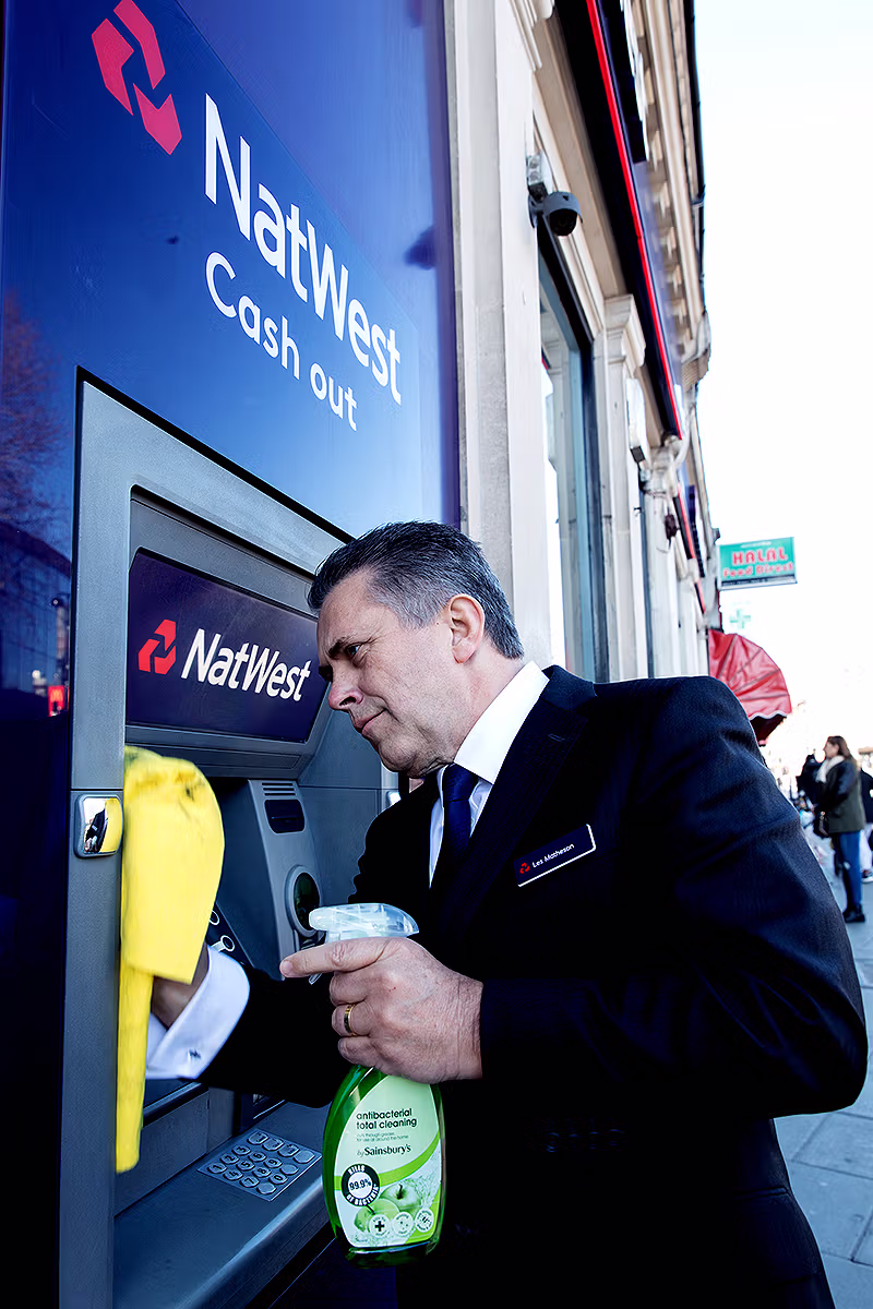 Portrait image of Les Matheson at NatWest Wood Green branch in North London photographed by London Photo Agency