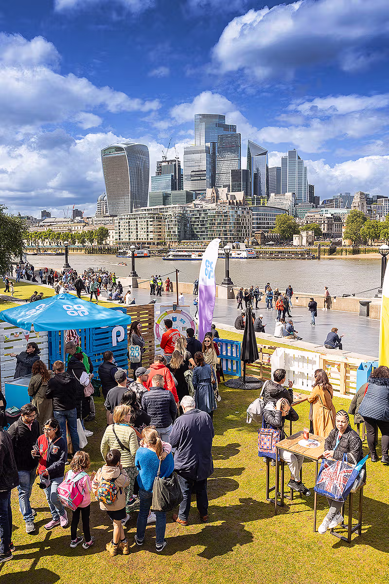 London PR photography from Co-op Food Festival showing crowds at Potters Fields Park with the River Thames and City of London skyline