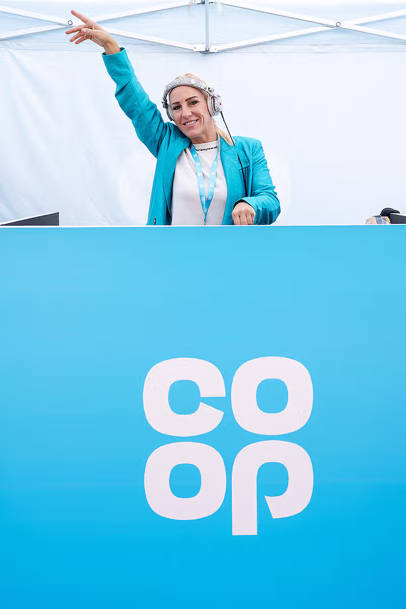 Co-op Food Festival PR photography showing DJ entertainment and branded booth activity at Potters Fields Park in London