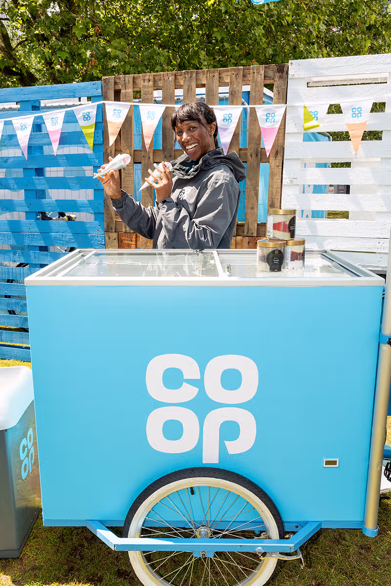 Consumer PR photography in London showing family engagement with Team Blue and Team White paddles at the Co-op Food Festival