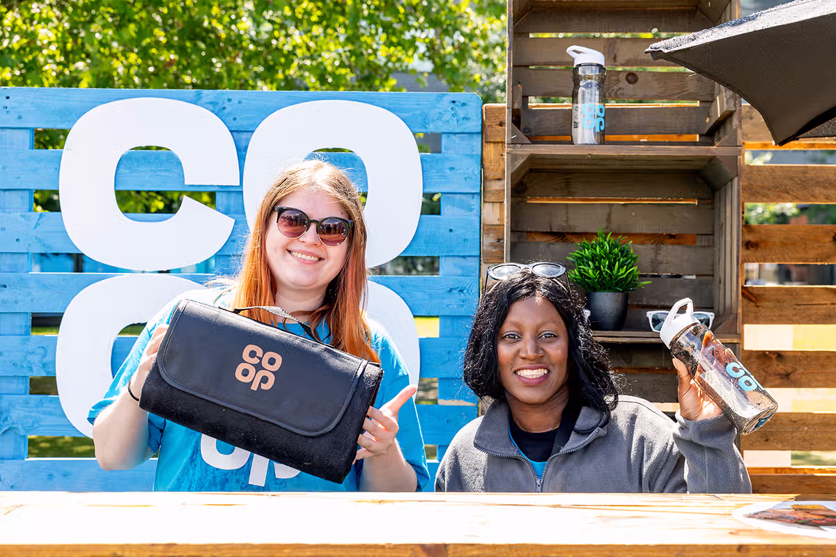 Consumer PR photography in London showing Co-op Food Festival visitor spinning a prize wheel for member rewards